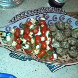 Umm mmm good! Teardrop tomato & mozzerella with basil skewers and stuffed mushrooms